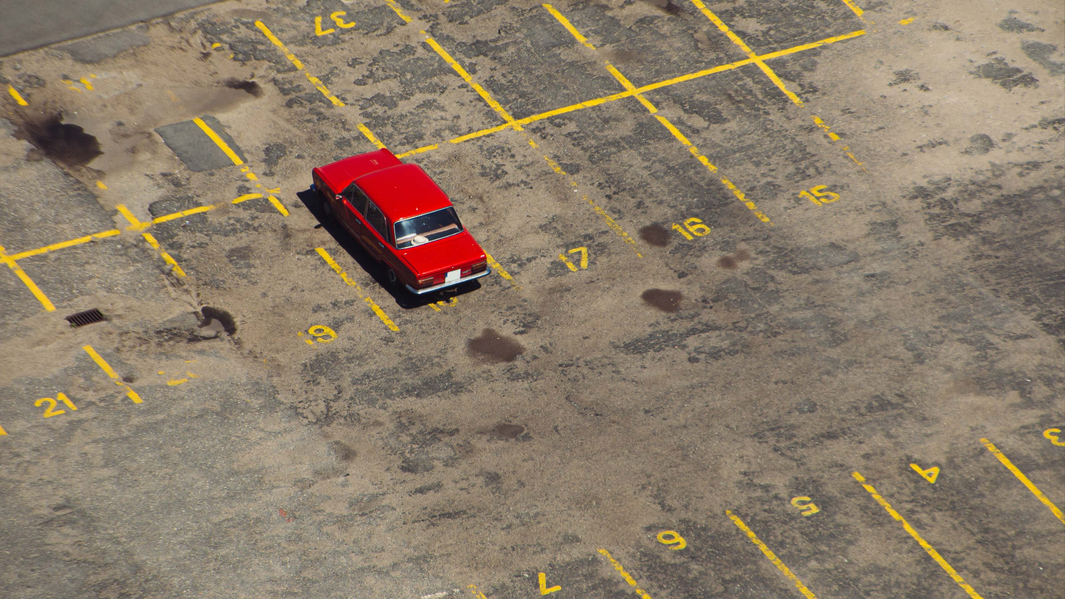 A vehicle from a fleet standing idle in a parking lot.